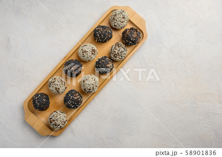 Homemade energy balls close up on wooden tray 58901836