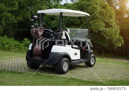 Golfcar in beautiful golf course in the evening Golfcar in beautiful golf course in the evening 58903573