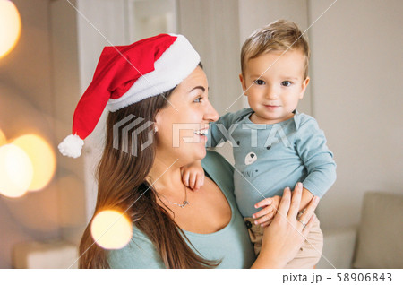 Charming little baby boy with mom brunette woman Charming little baby boy with mom brunette woman 58906843