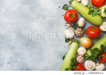 Set of different seasonal vegetables on a gray 58906932