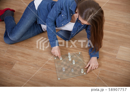 woman play chess woman play chess 58907757