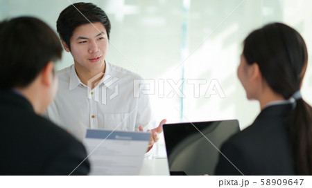 Concept applying work,Interviewing job seeker presenting their resume for executives to consider. 58909647