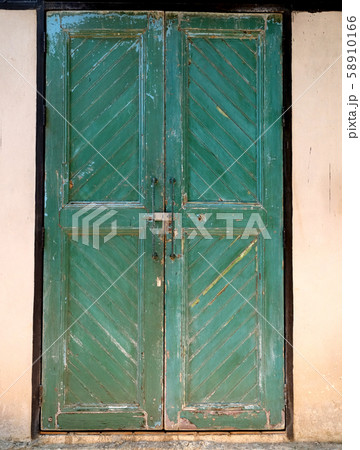 green wood door classic in an old building green wood door classic in an old building 58910166