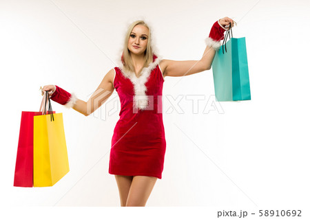 A beautiful sexy woman in a New Year's dress, hold A beautiful sexy woman in a New Year's dress, hold 58910692