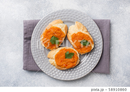 Sandwiches with bread zucchini caviar tomatoes Sandwiches with bread zucchini caviar tomatoes 58910860