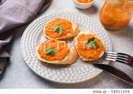 Sandwiches with bread zucchini caviar tomatoes onions. Homemade vegetarian food. Copy space. Sandwiches with bread zucchini caviar tomatoes onions. Homemade vegetarian food. Copy space. 58911359