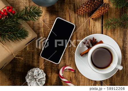 Mock up blank empty screen of smartphone on wooden background Mock up blank empty screen of smartphone on wooden background 58912208