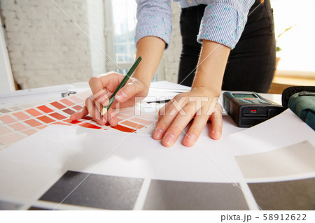 Interior designer working with colour palette in modern office 58912622