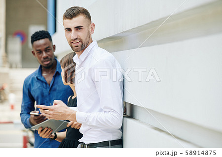 Handsome positive entrepreneur Handsome positive entrepreneur 58914875