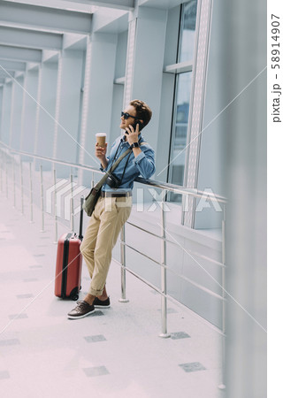 Happy man making call from airport stock photo 58914907