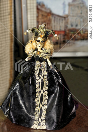 Doll of young Halloween witch in a black evening 58914952