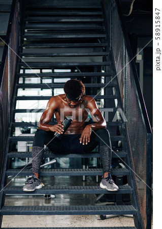 Fit young man after exhausting training Fit young man after exhausting training 58915847
