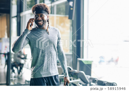 Happy man talking on phone after training 58915946