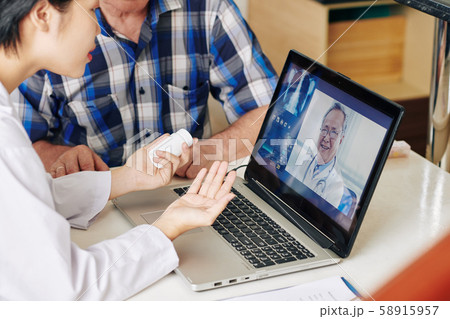Nurse and patient videocalling general practitioner Nurse and patient videocalling general practitioner 58915957