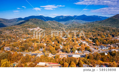 Aerial view picturesque Asheville neighborhood during the Fall with colors starting to show 58919898