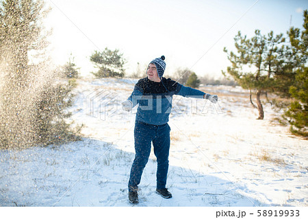 Loving couple play snowballs in winter in the Loving couple play snowballs in winter in the 58919933