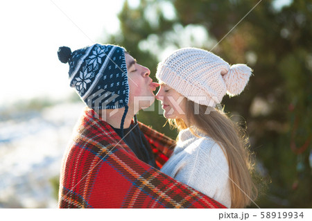 Winter walk through the woods. The guy with the Winter walk through the woods. The guy with the 58919934