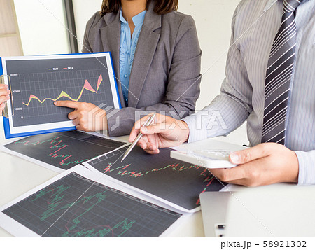 Businessman and businesswomen discussion and analyze stock graph report, set targets for online trading management success Businessman and businesswomen discussion and analyze stock graph report, set targets for online trading management success 58921302
