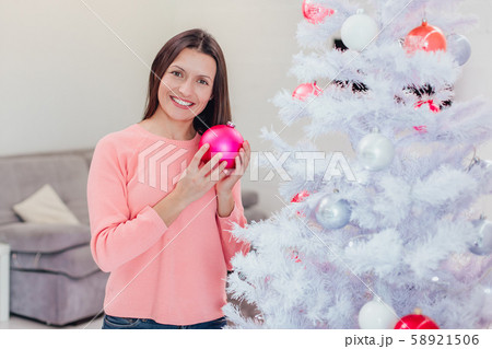 Christmas tree and new year concept photo in white-pink hue. Christmas tree and new year concept photo in white-pink hue. 58921506