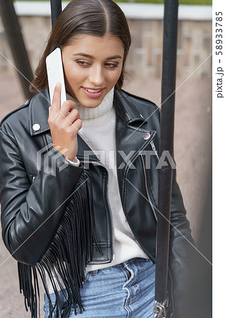 Pretty woman flirting during her phone call 58933785