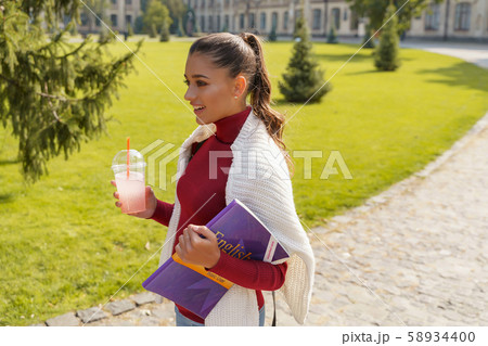 Beautiful girl waiting for her groupmates before lessons Beautiful girl waiting for her groupmates before lessons 58934400