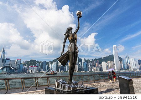 Tourists visiting the Avenue of the Stars. The Avenue of Stars is located along the Victoria Harbor in Hong Kong.  Tourists visiting the Avenue of the Stars. The Avenue of Stars is located along the Victoria Harbor in Hong Kong.  58941510