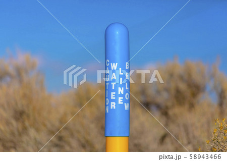 Water Line Below sign on a blue pole yellow base Water Line Below sign on a blue pole yellow base 58943466