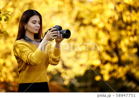 women photographer hold camera women photographer hold camera 58947751