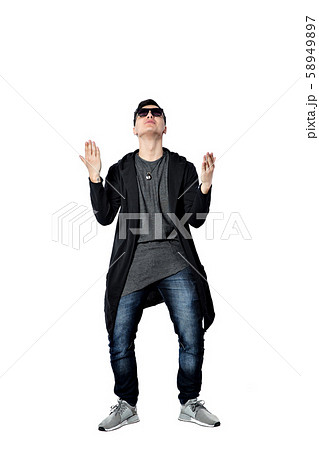 Casual young man wearing sunglasses, hands up, happy, positive a 58949897