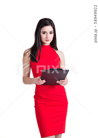 Beautiful office worker in red dress holding black folder Beautiful office worker in red dress holding black folder 58949922