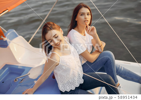 Two pretty girls in a summer park Two pretty girls in a summer park 58951434