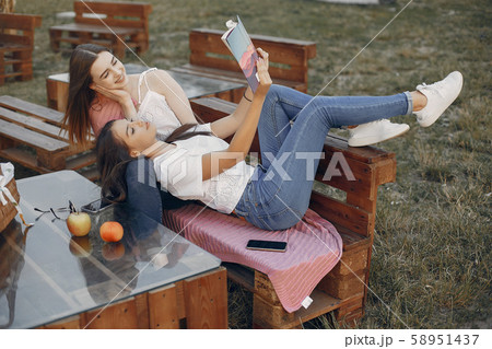 Two pretty girls in a summer park 58951437