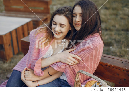 Two pretty girls in a summer park Two pretty girls in a summer park 58951443