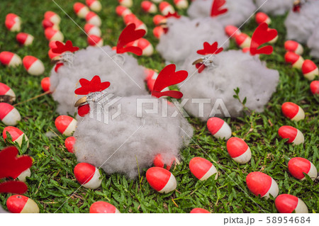 Chicken and red eggs on the lawn Chicken and red eggs on the lawn 58954684