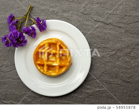 vanilla waffle on a white plate with purple vanilla waffle on a white plate with purple 58955878