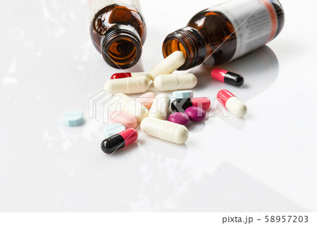 the pile of pills and capsules with white the pile of pills and capsules with white 58957203