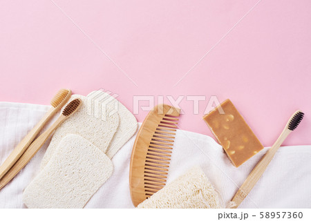 Body care products on a pink background, flat lay top view Body care products on a pink background, flat lay top view 58957360