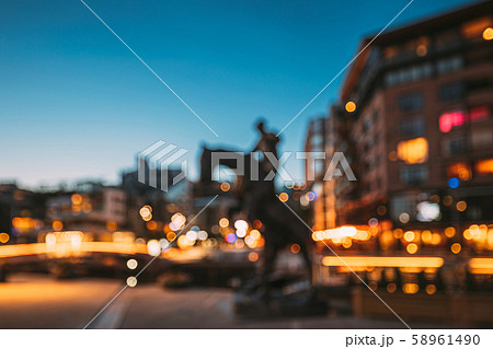 Oslo, Norway. Night Abstract Boke Bokeh Background Effect. Horse Statue On The Street And Oslo, Norway. Night Abstract Boke Bokeh Background Effect. Horse Statue On The Street And 58961490