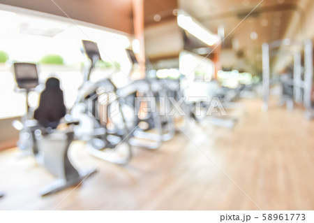 Blur gym background fitness center or health club with blurry sports exercise equipment for aerobic workout and bodybuilding 58961773