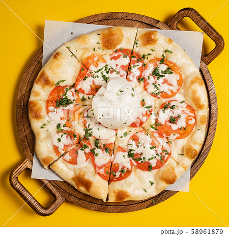 vegetarian pizza with tomato and mozzarella 58961879