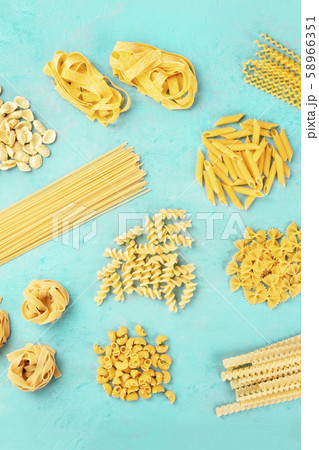 Italian pasta variety, flat lay banner, overhead shot on a blue background Italian pasta variety, flat lay banner, overhead shot on a blue background 58966351