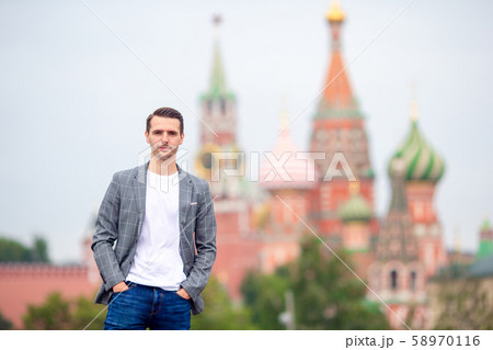 Happy young urban man in european city. Happy young urban man in european city. 58970116