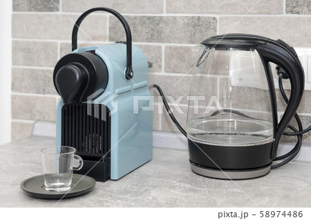 Coffee machine and electric kettle in the kitchen 58974486
