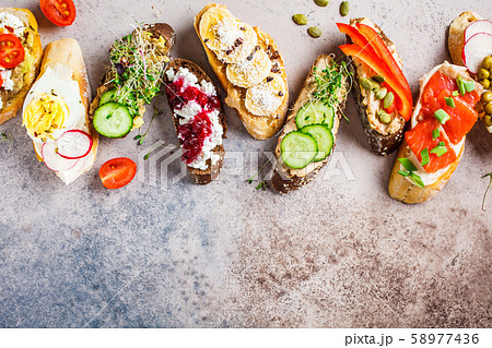 Open toasts with different toppings Open toasts with different toppings 58977436