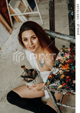 Female artist hand holding paintbrush 58978184
