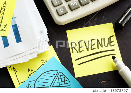 Revenue concept. Desk with stack of accounting Revenue concept. Desk with stack of accounting 58978797