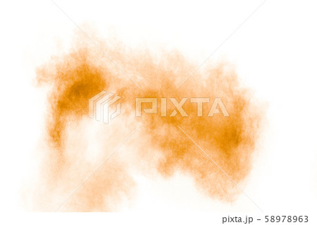 Abstract light orange powder explosion on white background.Freeze motion of light orange dust particles splash. Abstract light orange powder explosion on white background.Freeze motion of light orange dust particles splash. 58978963