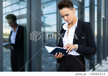 portrait of a successful businesswoman on the background of a skyscraper portrait of a successful businesswoman on the background of a skyscraper 58982013