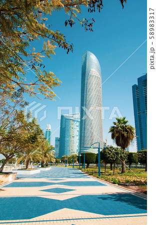 Abu Dhabi Corniche walking area with landmark view 58983317