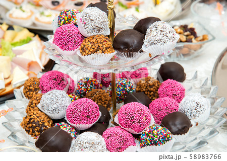 assortment of colorful petit fours for event or 58983766